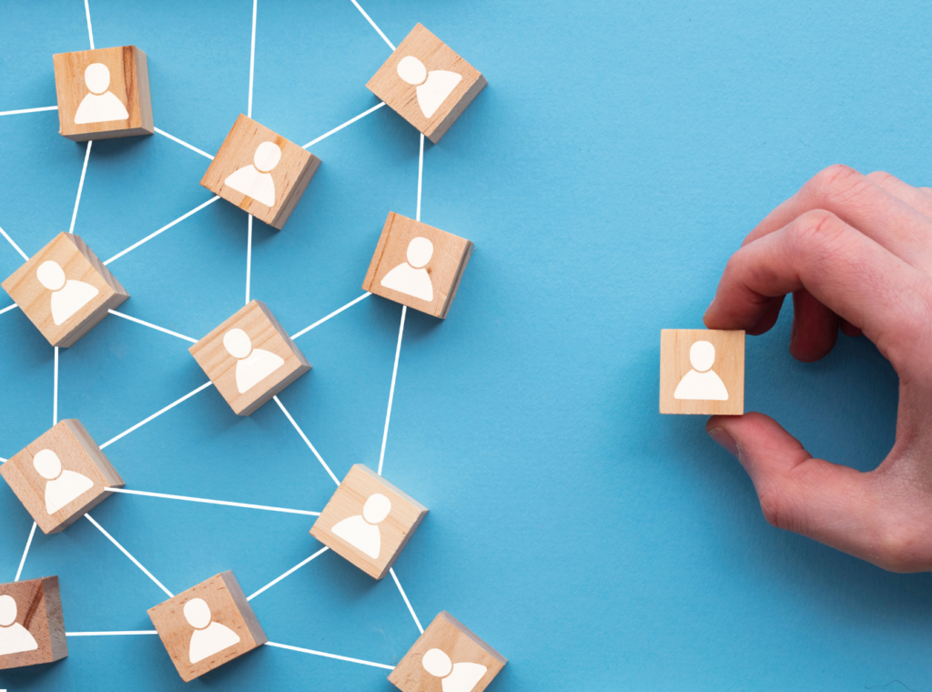abstract image of a network of small wooden blocks with people icons
