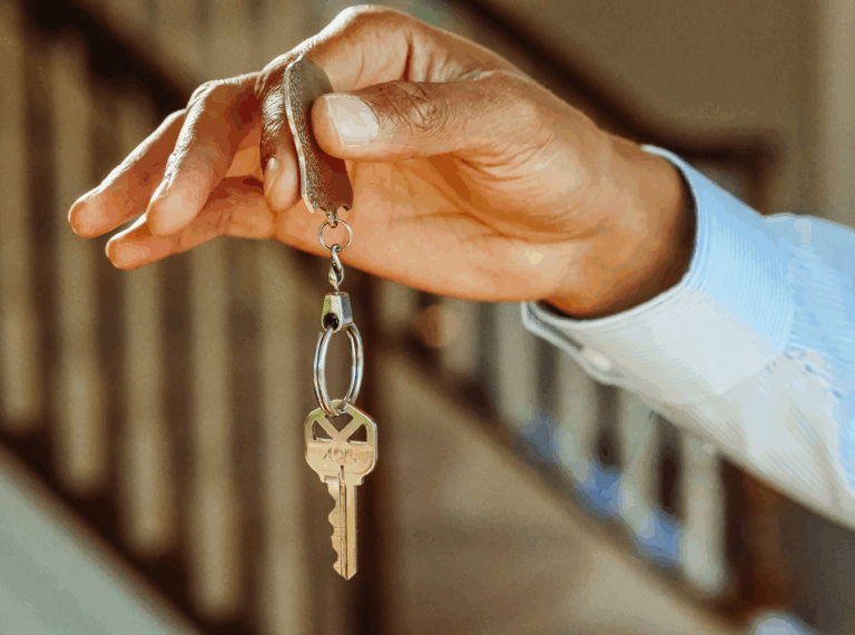 a hand holding a key